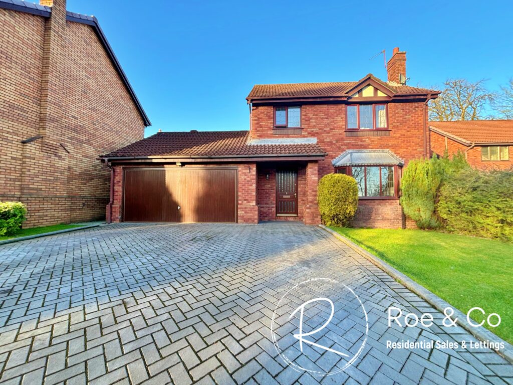 large detached house with double garage
